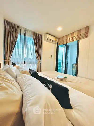 Luxurious bedroom with balcony view and elegant decor