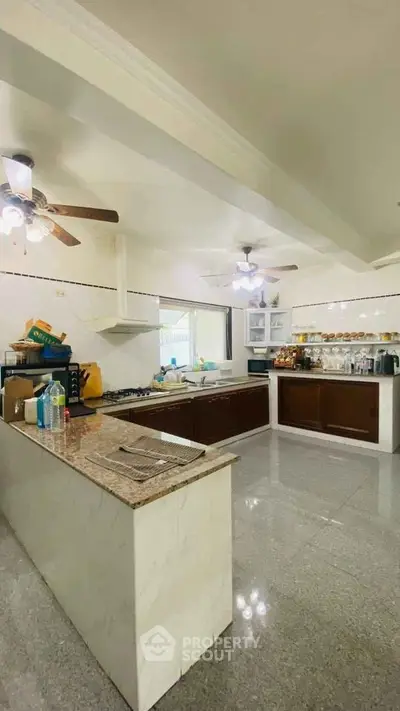 Spacious kitchen with open layout and modern appliances