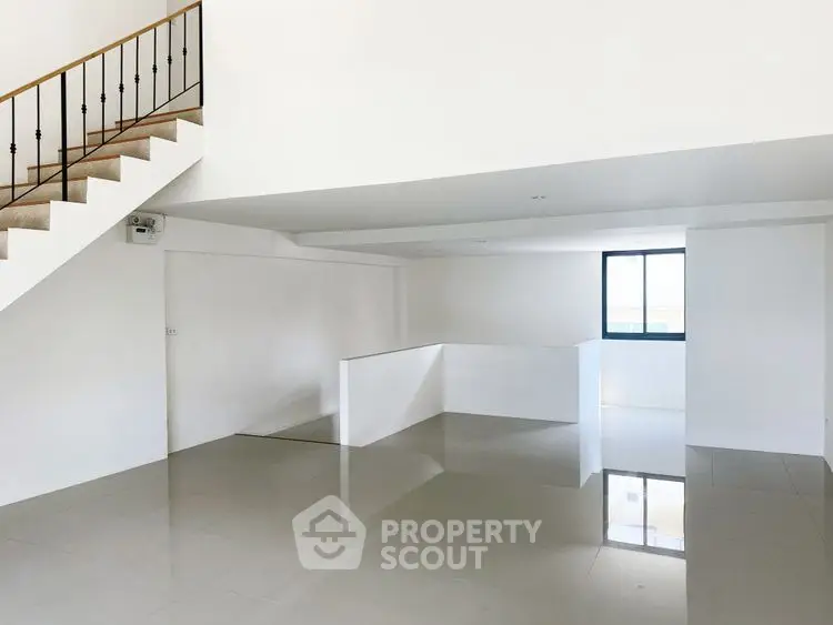 Spacious modern interior with glossy floors and staircase, perfect for customization.