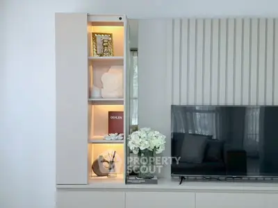 Modern living room with sleek TV unit and elegant decor