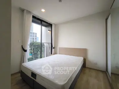 Modern bedroom with balcony view in urban apartment