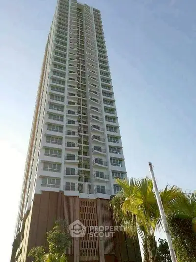 Stunning high-rise building with modern architecture and lush greenery.