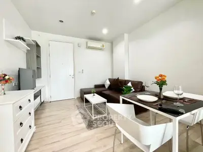 Modern living room with sleek furniture and bright decor in a stylish apartment.