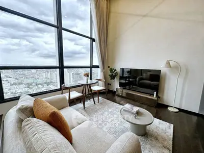 Luxurious high-rise living room with stunning city view and modern decor