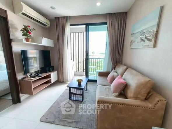 Cozy living room with modern decor and balcony view