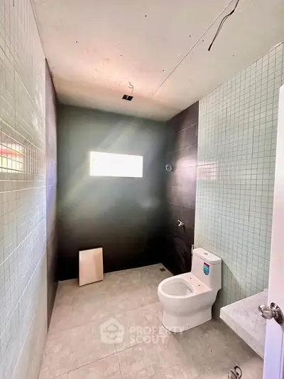 Modern bathroom with sleek tiles and natural light
