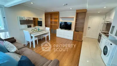 Stylish open-plan living room with modern kitchen and cozy dining area