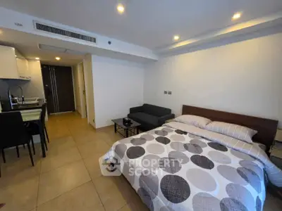 Modern studio apartment with cozy bedroom and open kitchen layout