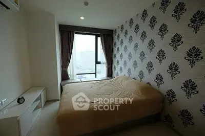 Modern bedroom with stylish wallpaper and city view window