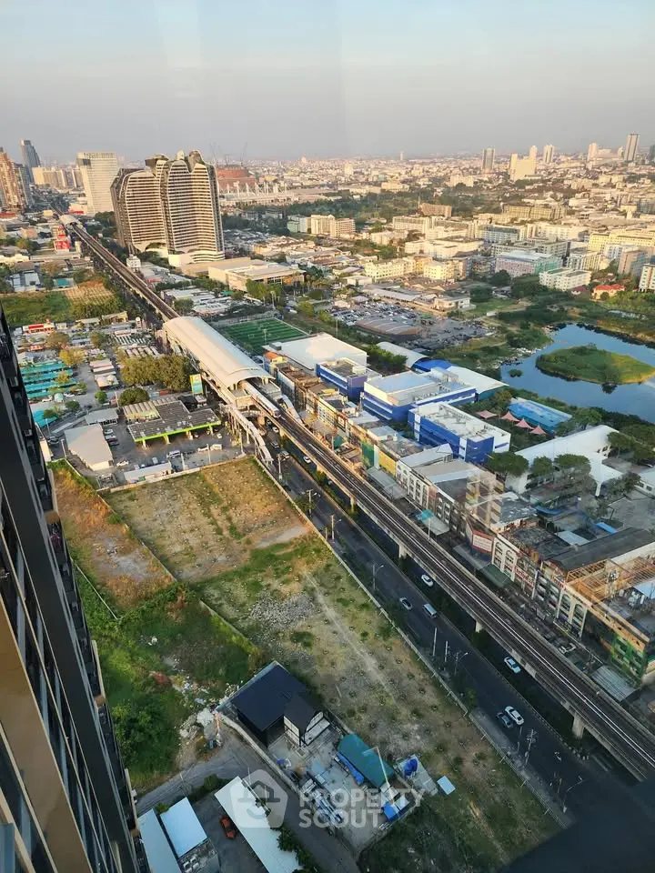 Stunning cityscape view from high-rise building showcasing urban landscape and transportation infrastructure.