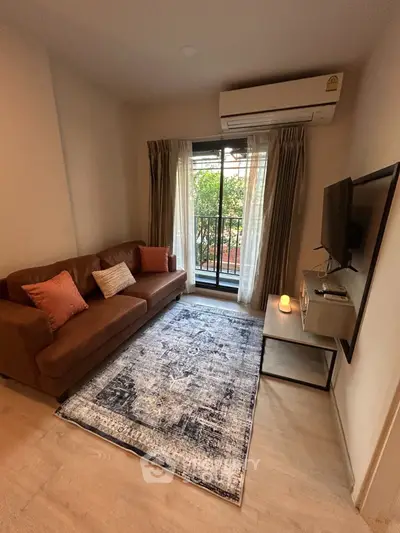 Cozy living room with modern decor and balcony view