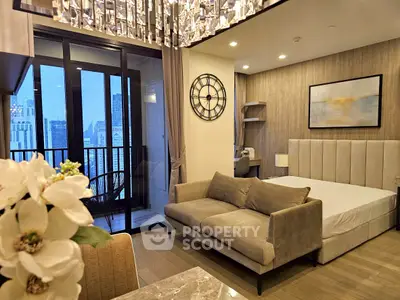 Luxurious modern studio with elegant decor and city view balcony, perfect for urban living.