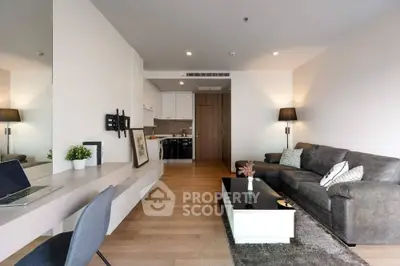 Modern living room with stylish decor and open kitchen layout