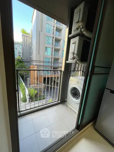 Modern apartment balcony with washing machine and city view