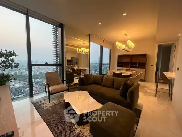 Luxurious high-rise living room with panoramic city views and elegant modern furnishings.