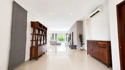 Spacious living room with elegant wooden furniture and modern decor