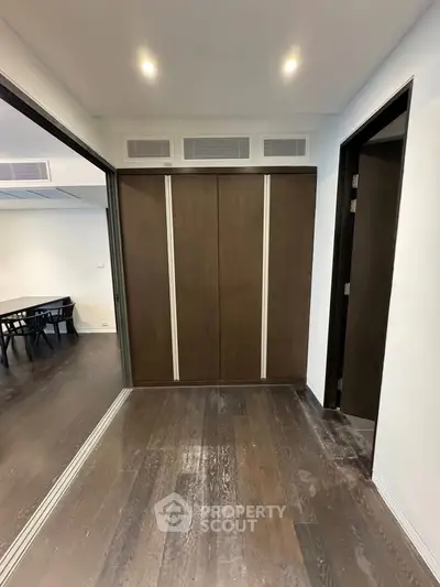 Spacious modern interior with sliding doors and wooden flooring