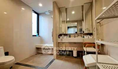 Spacious modern bathroom with sleek fixtures and ample storage