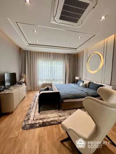 Luxurious bedroom with modern design, featuring elegant lighting, plush furnishings, and a serene ambiance perfect for relaxation and comfort.