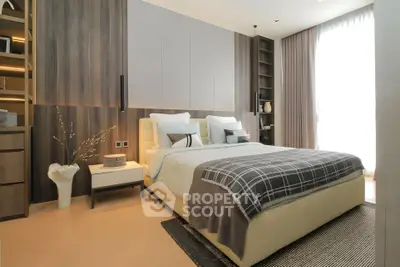 Modern bedroom with stylish decor and ample natural light