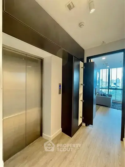 Modern apartment entrance with elevator and stylish interior design