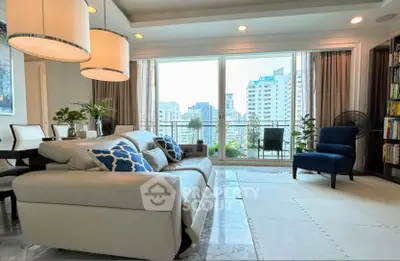 Luxurious living room with city view, elegant decor, and spacious seating area.