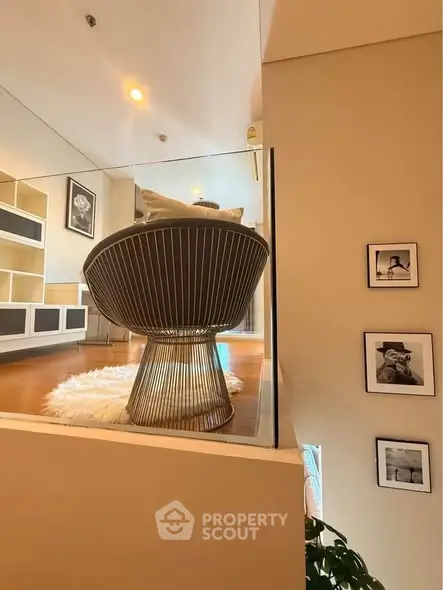 Stylish modern living room with unique chair and elegant decor