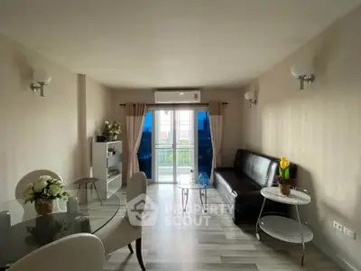 Spacious living room with modern decor and large windows for natural light.