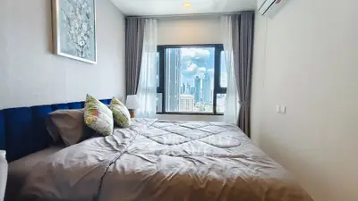 Luxurious bedroom with stunning city view and elegant decor