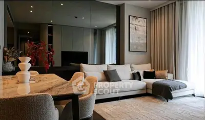 Elegant living room with modern decor and large sofa, perfect for relaxation.