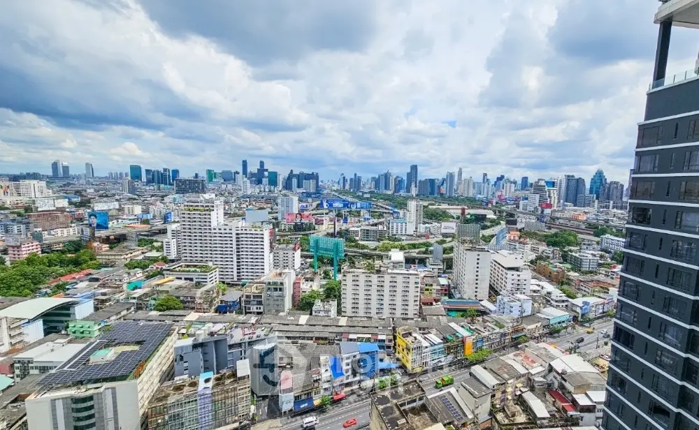 Stunning cityscape view from high-rise building showcasing urban skyline and vibrant city life.