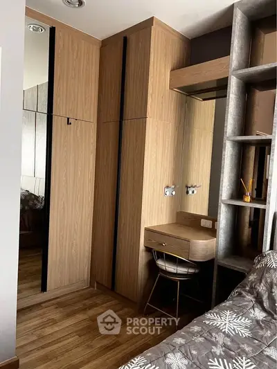 Modern bedroom with wooden wardrobe and stylish desk
