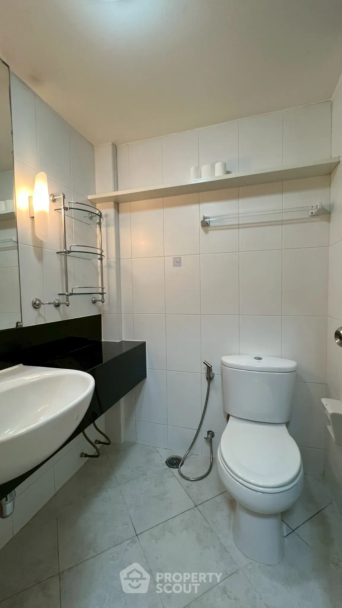 Modern bathroom with sleek fixtures and white tile design
