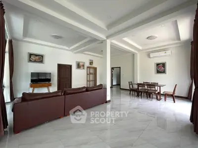 Spacious living room with modern furniture and elegant decor