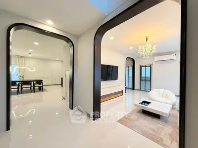 Luxurious modern living room with elegant chandelier and sleek design