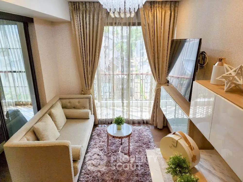 Chic living room with elegant decor, plush sofa, and balcony view in modern apartment.