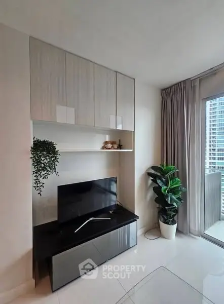 Modern living room with sleek TV stand and large window view