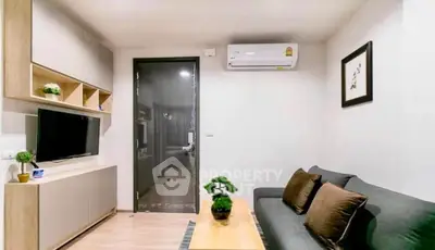 Modern living room with sleek furniture and air conditioning, perfect for cozy urban living.