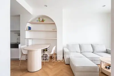 Modern living room with cozy sectional sofa and stylish dining area