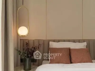 Elegant bedroom with modern lighting and cozy decor, perfect for relaxation.