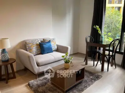 Cozy living room with modern furniture and large window view