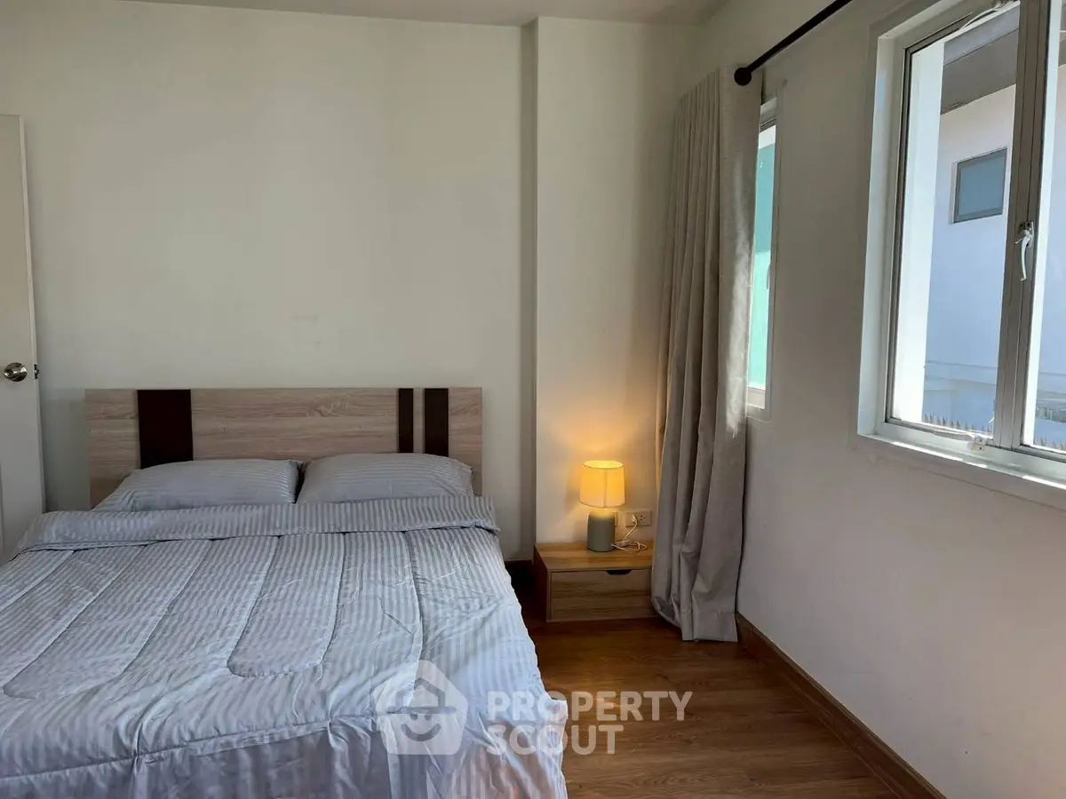 Cozy bedroom with natural light and modern decor