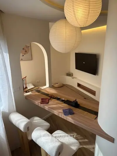 Stylish modern living room with unique wooden table and elegant lighting