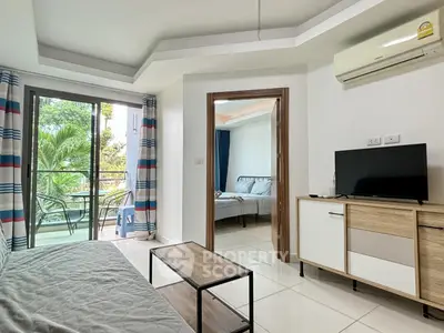 Modern apartment living room with balcony and bedroom view