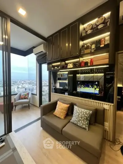 Modern living room with city view, stylish decor, and cozy seating area.