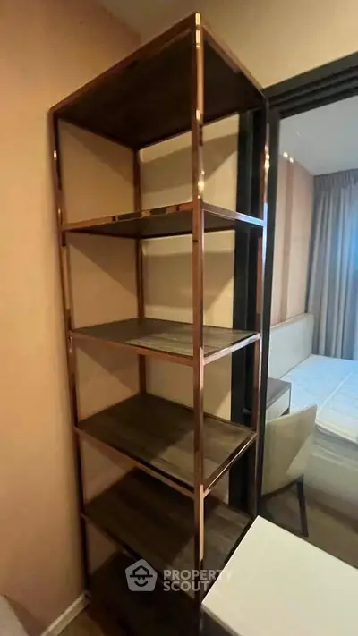 Modern bedroom with stylish shelving unit and elegant decor