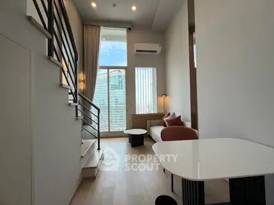 Modern loft apartment with high ceilings and city view