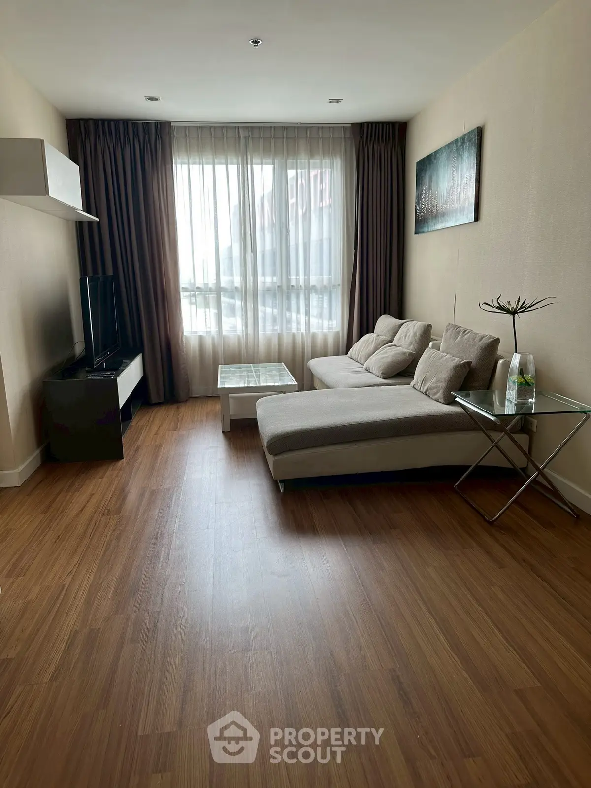 Modern living room with cozy sofa and natural light