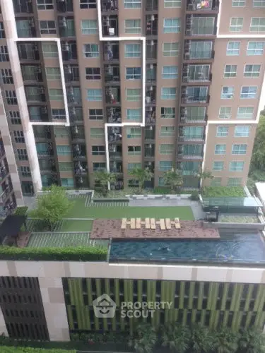 Modern apartment building with rooftop pool and garden view