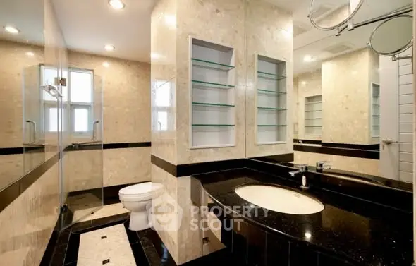Luxurious bathroom with elegant marble finishes and modern fixtures.